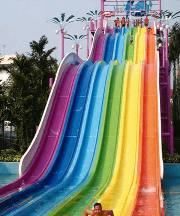 Colourful water slides side by side in a waterpark